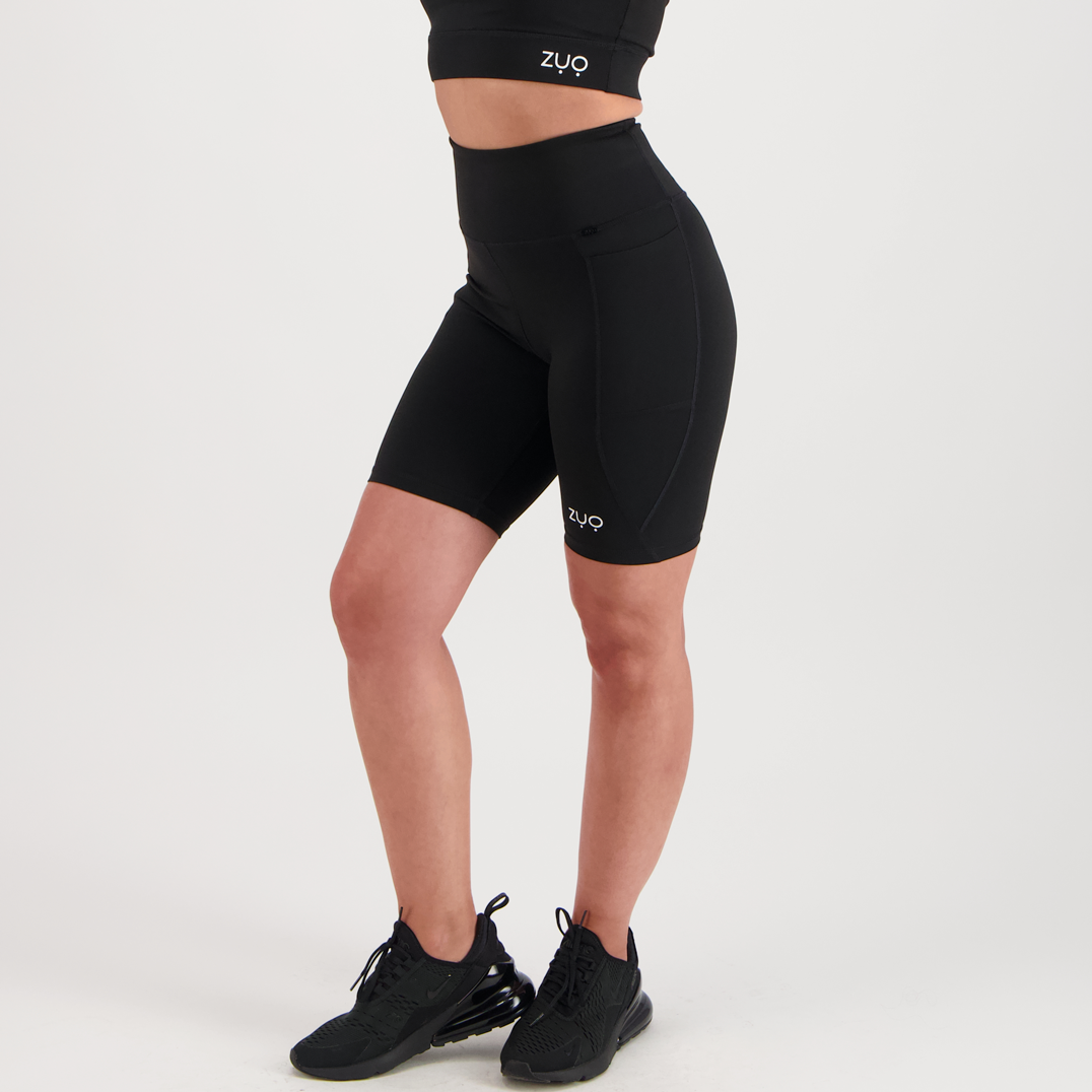 3/4 view, model in mid-length shorts in black
